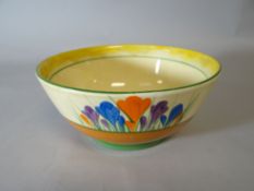 A Clarice Cliff footed bowl in the Crocus pattern for the Bizarre range, 7 ins diam (18 cms)