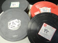 Five larger cans containing the five reel cinema release on 35mm film of 