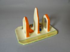 A Clarice Cliff three section toast rack in the Crocus pattern for the Bizarre range