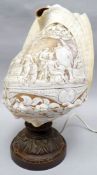 A Neapolitan carved conch shell table-lamp, exceptionally carved with a cameo of Greek mythology