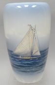 A Royal Copenhagen baluster vase decorated with racing yacht in calm seas, 7.75 ins high (19 cms)