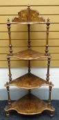 A burr-walnut and marquetry what-not composed of four graduated shaped shelves on turned-supports (