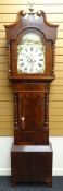 A Victorian cross-banded mahogany eight-day longcase clock having a painted arched dial, inscribed