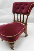 A small Victorian occasional chair with spindle back, the upholstered rail and seat in purple