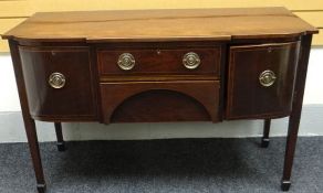 A Regency style inlaid and crossbanded mahogany break-front sideboard composed of two centre drawers