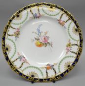 A Royal Crown Derby plate, finely painted with a centre sprig of flowers and six posies to the