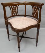 A fine quality inlaid mahogany Edwardian bedroom chair with shaped upholstered seat, curved rail and