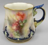 A Hadley's of Worcester blush ivory, blue glazed and gilded mug of flared form painted all-round