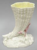 A Royal Worcester naturalistic vase in the form of a cornucopia on a sea-bed base, date mark for