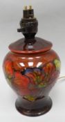 A Moorcroft 'Clematis' baluster table-lamp base in flambe ground, 8.5 ins high (22 cms)