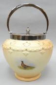 A Locke & Co blush ivory biscuit barrel painted with pheasants in an extensive landscape by E