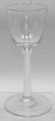 A Georgian air-twist stem glass with circular foot and funnel-bowl, 6.25 ins high (16 cms)