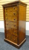 A fine mid-Victorian burr-walnut secretaire Wellington-chest having six graduated drawers, two of