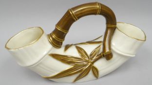 A Royal Worcester blush ivory and gilt double-ended vase in the form of bamboo with applied