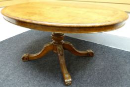 A fine quality mid-Victorian burr walnut oval centre-table, the highly-decorative base composed of