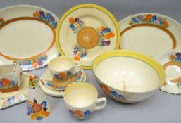 A parcel of Clarice Cliff 'Crocus' pattern tableware including teapot stand, two cups and saucers,
