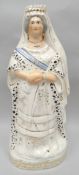 A commemorative Staffordshire pottery portrait-figure of Queen Victoria standing in ermine lined
