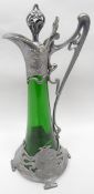 A WMF Art Nouveau pewter and green glass claret-jug and stopper, 16.25 ins high (42 cms) (glass