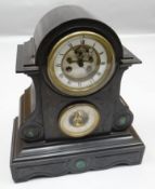 A Victorian black slate clock and barometer mantel set, each dial of circular white enamel form, the