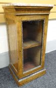 A fine quality Victorian inlaid burr walnut gilt-metal mounted cabinet of small and narrow