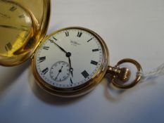 A 9ct yellow gold Walthan full-hunter pocket watch with Roman numerals to the white enamel dial