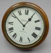 A good turn-of-the-century mahogany encased circular dial pendulum-wall clock with fusee movement,