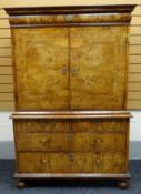 A fine quality Queen Anne period walnut cabinet-on-chest having a base of two long and two short