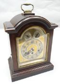 An Edwardian mahogany encased chiming bracket clock with arched silvered dial, maker's mark for