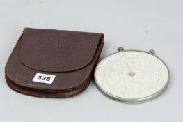 A Fowler Magnum long scale calculator with instruction book and leather case, made between 1930