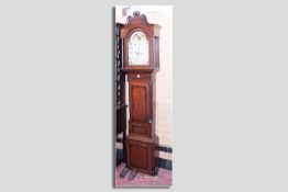 A 19th Century oak and mahogany longcase clock with arched twin swan pediment hood, single arched