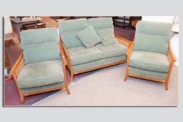 An excellent quality modern Parker Knoll double Bergere teak and green upholstered  three piece