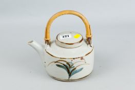 A David Leach Studio stoneware lidded teapot with cane handle having a simple floral decoration to