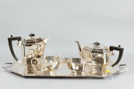 An electroplated four piece Art Deco style teaset with ebonized handles and an associated Art Deco