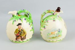 Two Crown Devon moon shaped flasks titled 'Auld Lang Syne', one with musical box and stopper (all