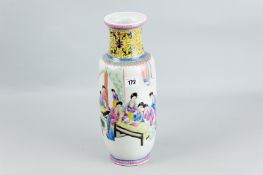 An early 20th Century slender vase with waisted yellow ground enamel decorated neck, the front