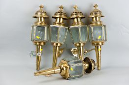 A group of five 20th Century brass electric carriage type lamps all with cut and bevelled edge