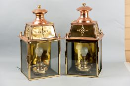 A pair of Georgian and later brass and copper exterior lanterns, later converted for electricity,
