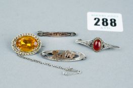 A parcel of four silver brooches - one oval citrine and marcasite surround with safety chain, two