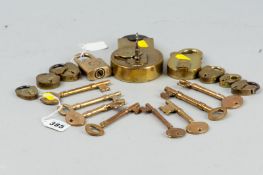 A small selection of polished brass padlocks, one large by E Cotterill & Co, along with a small