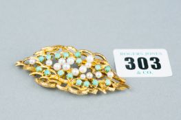 An eighteen carat gold bark effect oval pin brooch decorated seed pearls and turquoise, total 20