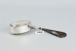 An oval silver snuff box with initialled lid, 2.4 ozs, Birmingham 1900 and a silver handled shoe