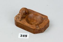 An oak Robert Mouseman Thompson carved ashtray with signature mouse, 4.25 ins (11 cms) in length