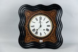 A French ebonized pendulum wall clock, a shaped ebony and inlaid glass fronted outer case containing