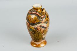 A late 19th/early 20th Century Japanese Satsuma ovoid vase, predominantly gilt decorated with