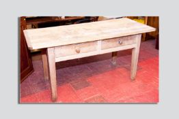 An elm top and pine base two drawer farmhouse table, the three boarded top with cleated and
