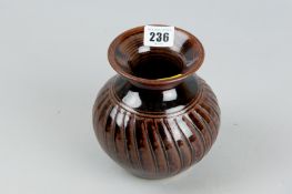 A Studio pottery vase of globular form with flared neck and incised banding, monogram to the base