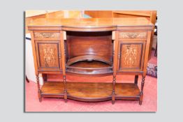An Edwardian inlaid rosewood sideboard base having two drawers over two cupboards with boxwood