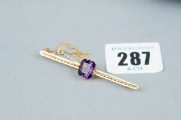 A nine carat gold bar brooch with square cut amethyst and safety chain and original box, total 4