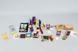 A parcel of Masonic ribbons and badges etc including two or three silver gilt items