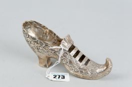 A model lady's high heeled slipper with scrolled floral decoration, 15 cms long, 3.4 ozs,